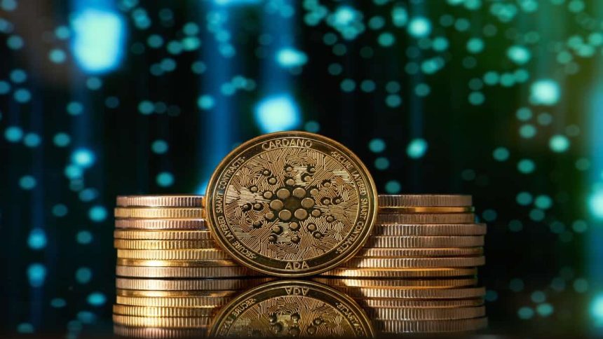 Golden Cardano ADA coin stacked with other coins against blue digital background