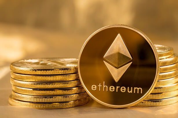 Picture of ethereum coins staked together with one coin stood next to them